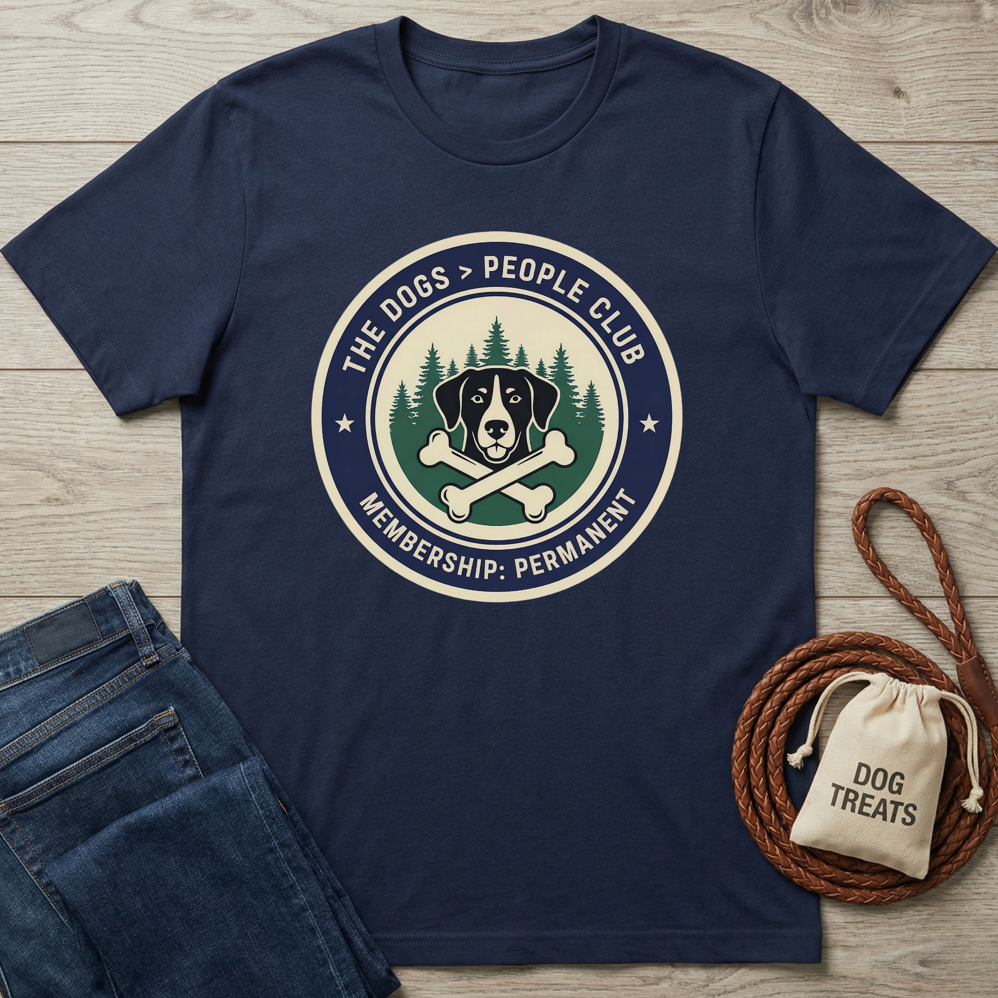 Navy blue cotton t-shirt with "The Dogs > People Club" logo featuring a dog, pine trees, and crossed bones.