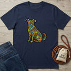 Navy "Love In Color" t-shirt with a vibrant, colorful, patterned dog design, next to jeans and dog treats.