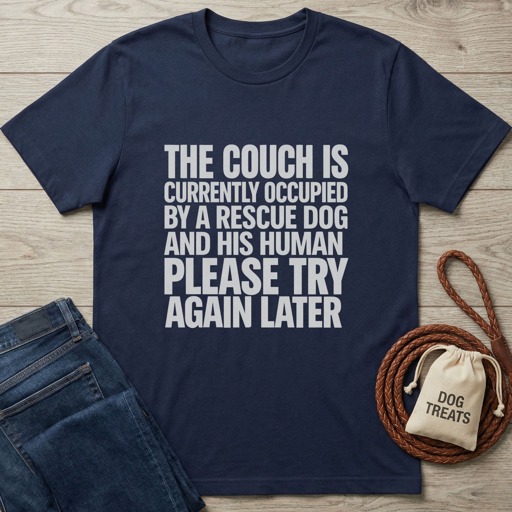 Navy blue Gildan Softstyle® t-shirt with "THE COUCH IS CURRENTLY OCCUPIED BY A RESCUE DOG AND HIS HUMAN PLEASE TRY AGAIN LATER" text.