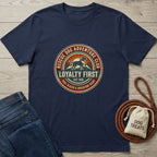 Navy blue Gildan Softstyle t-shirt with a "Rescue Dog Adventure Club" graphic, paired with jeans and dog treats.