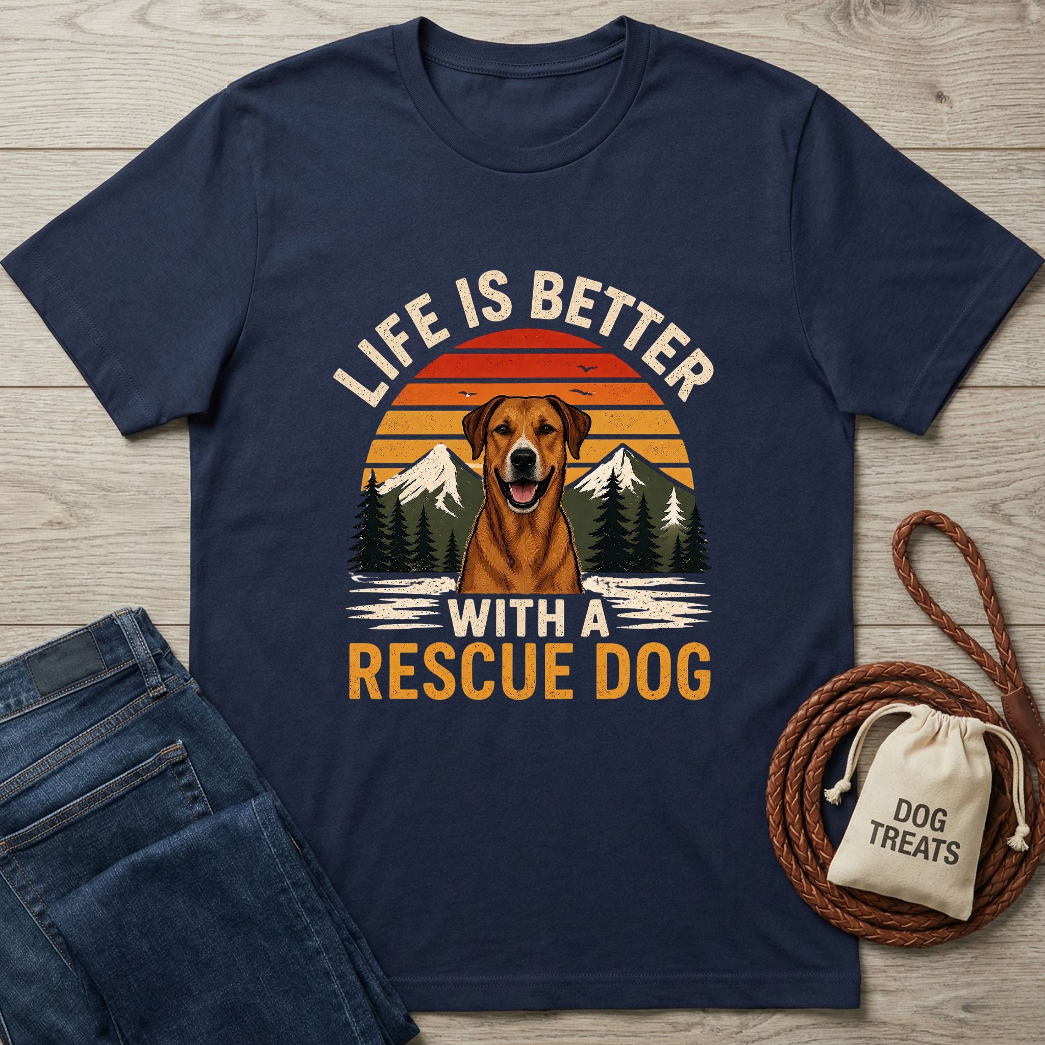 Navy blue Gildan Softstyle® t-shirt with "Life is Better With A Rescue Dog" graphic, jeans, and dog treats.
