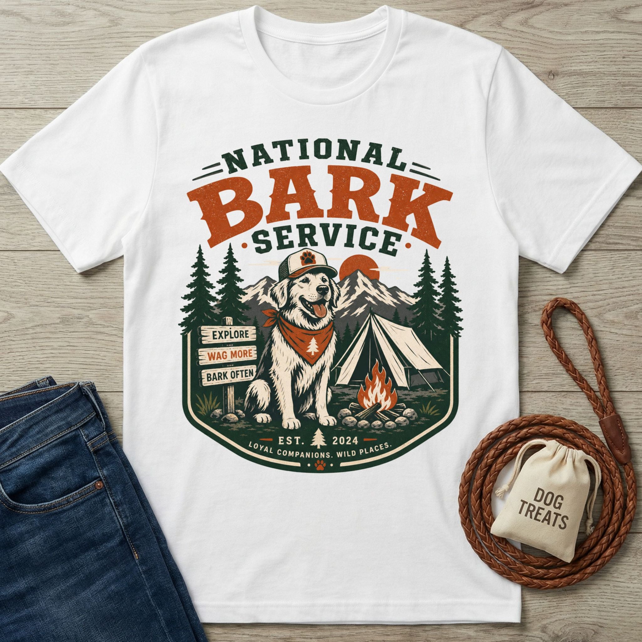 White crewneck t-shirt featuring a National Bark Service graphic with a dog in a hat, campfire, and mountain landscape.