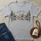 Grey crewneck t-shirt featuring a mountain, pine tree, and dog reflection graphic.