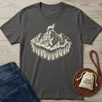 Charcoal gray cotton t-shirt with a cream graphic of a dog on a mountain peak surrounded by pine trees.