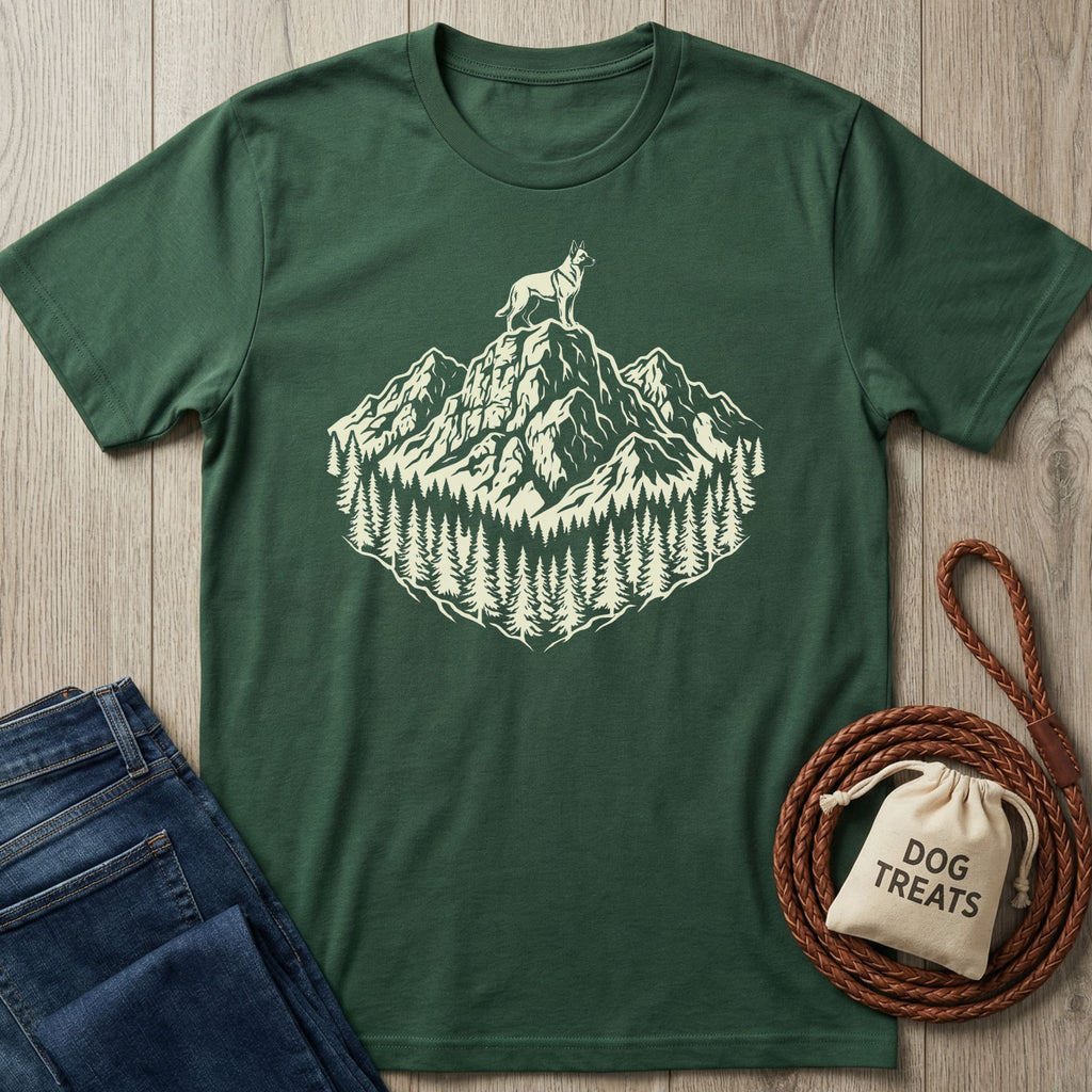 Dark green cotton t-shirt with a cream graphic of a dog on a mountain peak surrounded by pine trees.