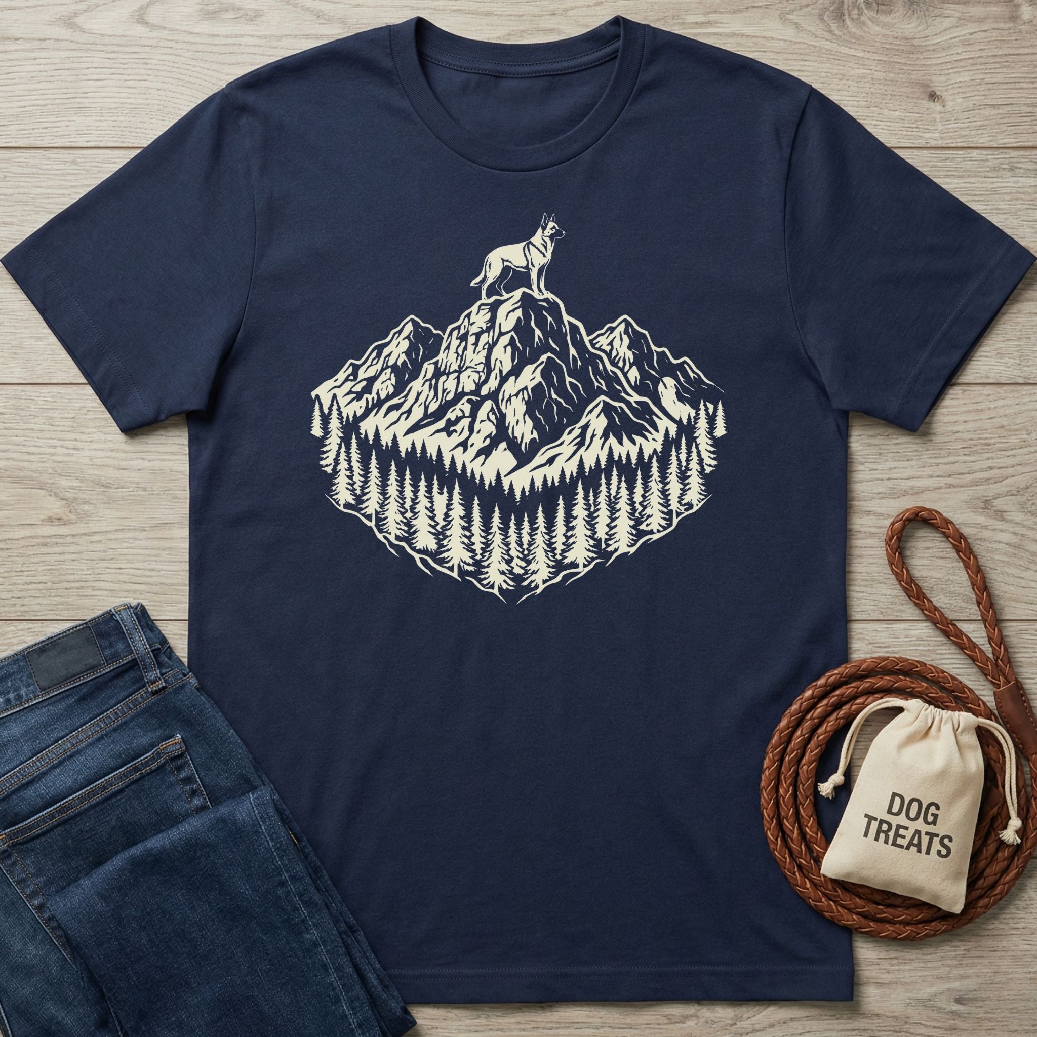 Navy cotton t-shirt with a cream graphic of a dog on a mountain peak surrounded by pine trees.