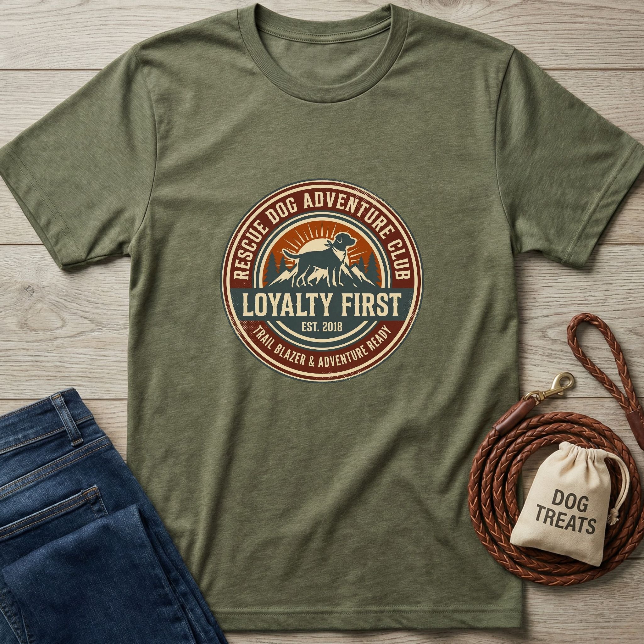 Olive green Gildan Softstyle® t-shirt with "Rescue Dog Adventure Club" graphic, jeans, and dog leash.