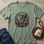Sage green Gildan Softstyle t-shirt with "Egg Hunter: Level Pro" graphic featuring a dog and Easter eggs.