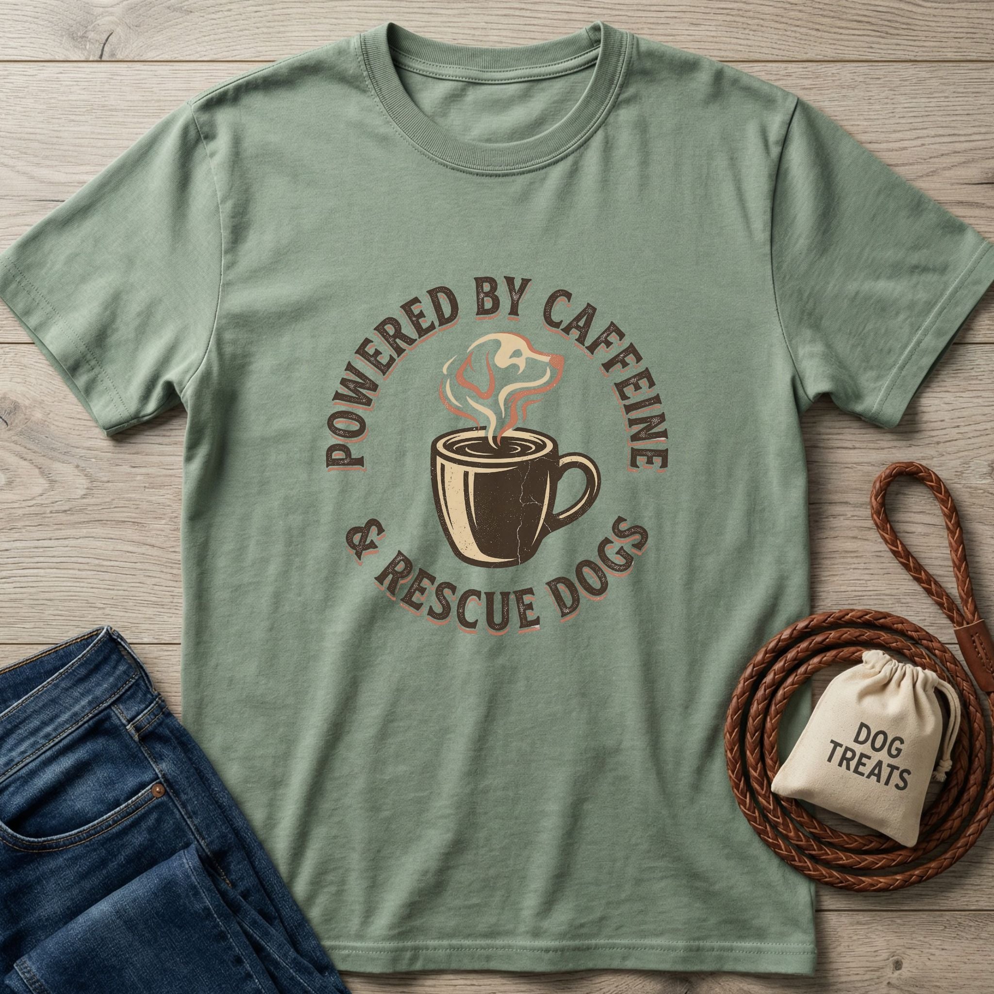 Sage green Gildan Softstyle® t-shirt with "Powered By Caffeine & Rescue Dogs" graphic.