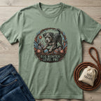 Sage green Gildan Softstyle t-shirt with a "Egg Hunter: Level Pro" graphic featuring a dog and Easter eggs.