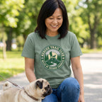 Woman in a green "Rescue Trail Club" graphic tee with a pug, promoting dog rescue.