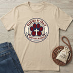 Tan Gildan Softstyle® t-shirt with "Rescued By Grace, Adopted & Blessed" paw print design.