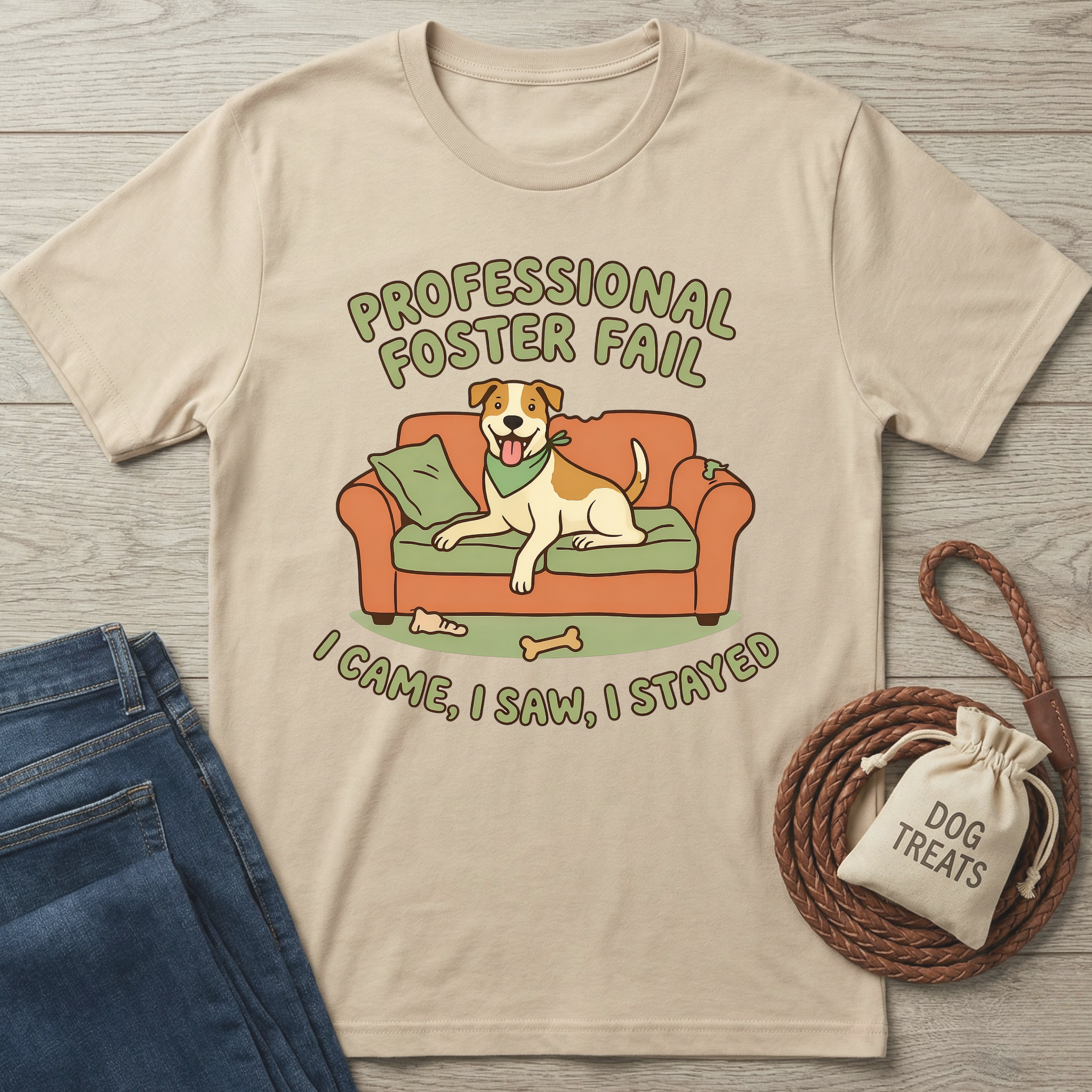 Beige cotton t-shirt with "Professional Foster Fail" text and a happy dog on an orange couch design.