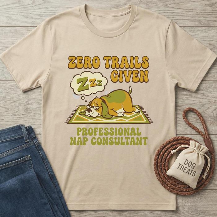 Beige cotton t-shirt with "Zero Trails Given" and a sleeping beagle, "Professional Nap Consultant" text.