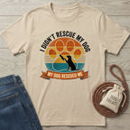 Beige Gildan Softstyle® 64000 t-shirt with "I Didn't Rescue My Dog, My Dog Rescued Me" graphic.