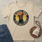 Rescue Mom T-shirt in natural with a black dog graphic and "The Best Breed Is Rescued" text.