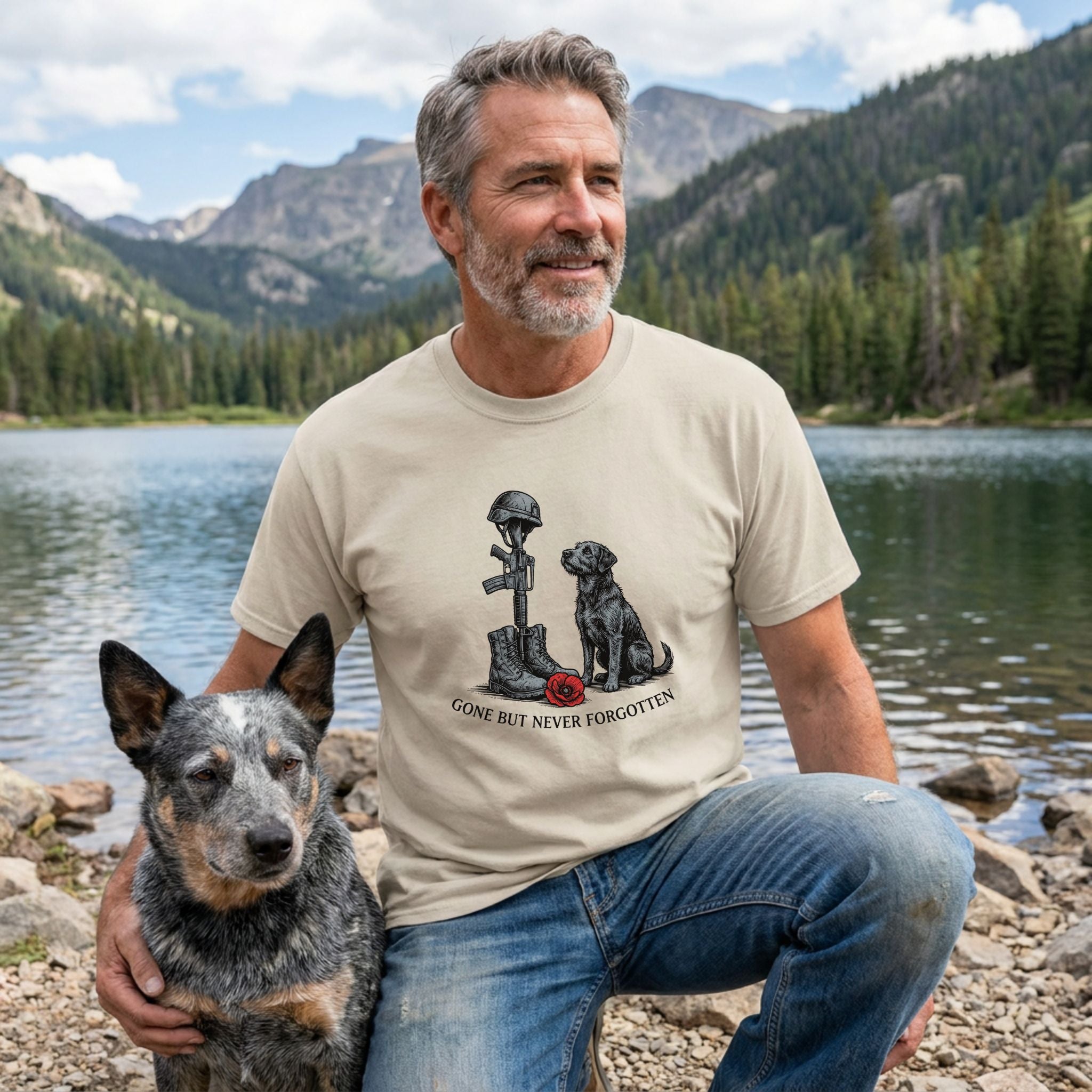 Man in a beige "Gone But Never Forgotten" t-shirt with a soldier's cross and black dog, next to a blue heeler.