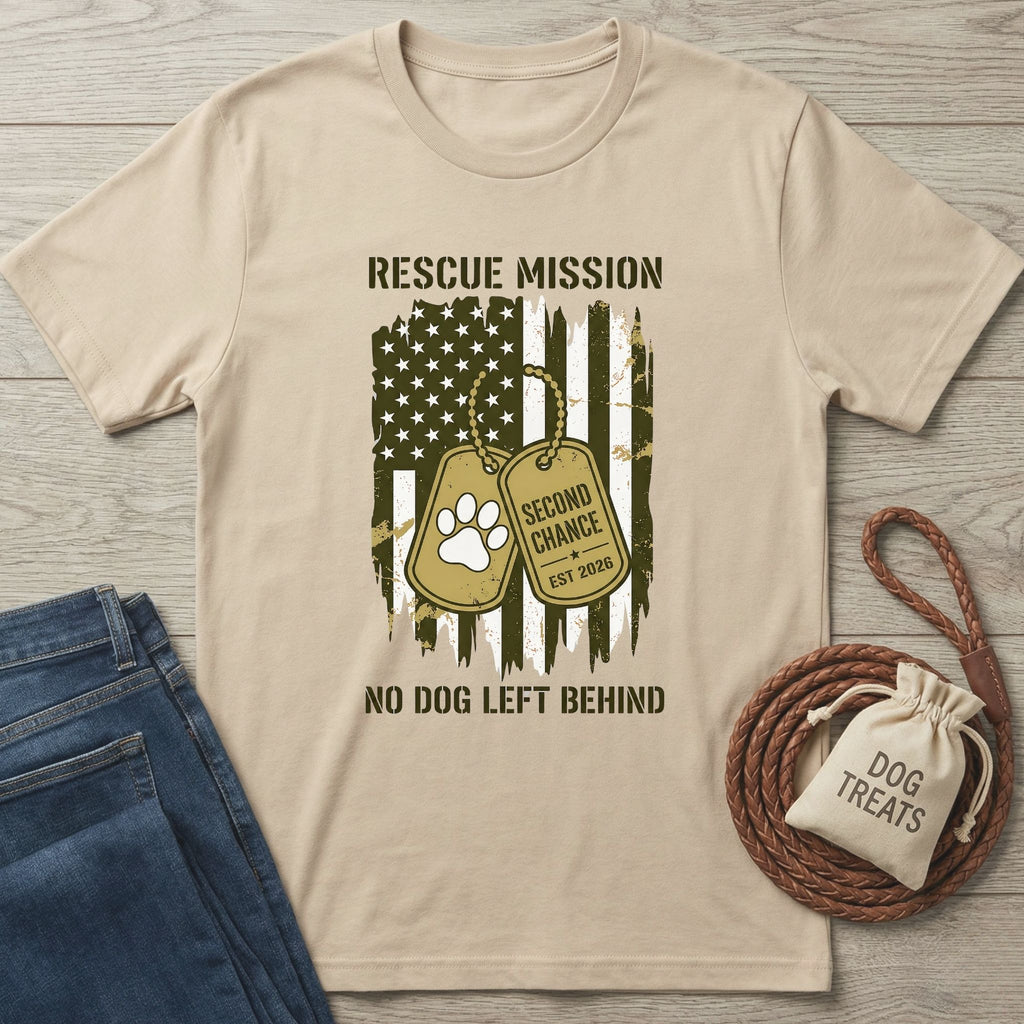 Tan cotton t-shirt with a distressed American flag, dog tags, "Rescue Mission," and "No Dog Left Behind" text.