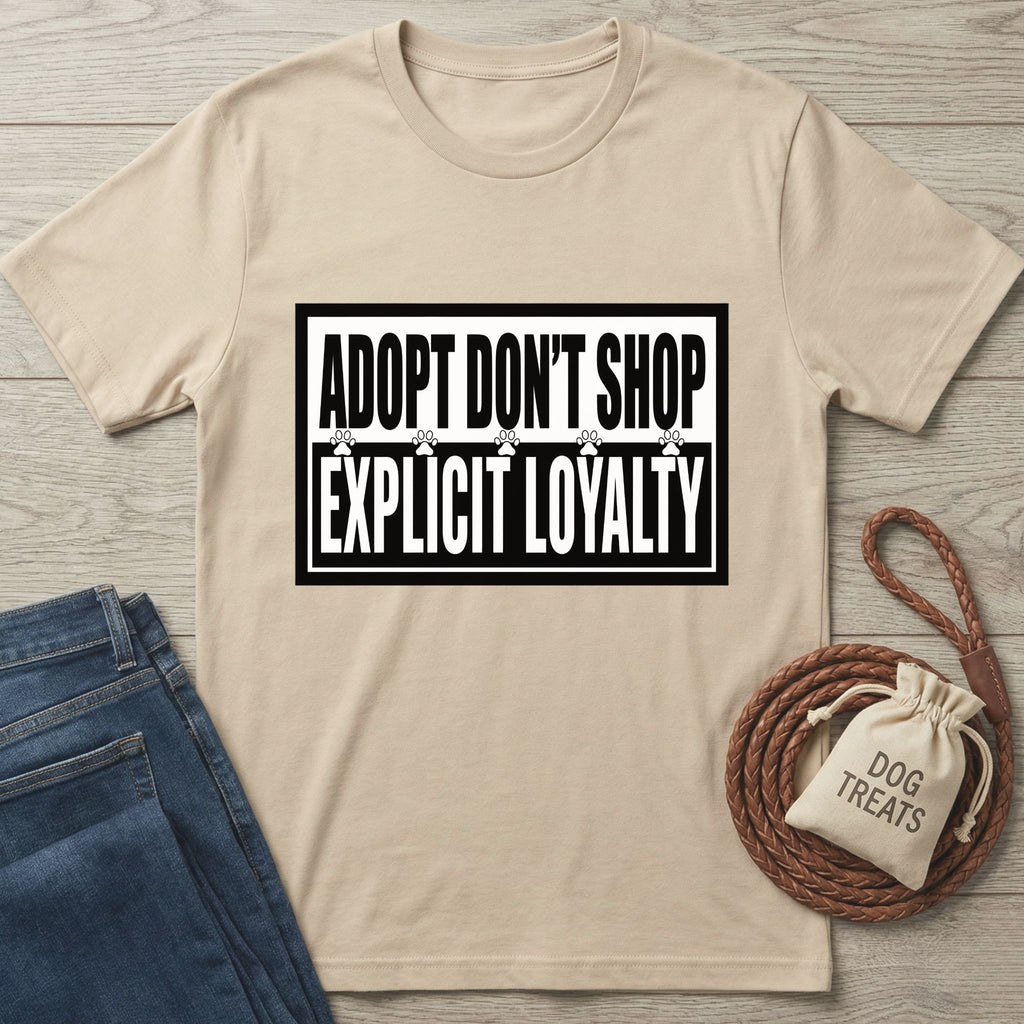 Beige Gildan Softstyle t-shirt with "ADOPT DON'T SHOP EXPLICIT LOYALTY" text, paw prints, and black borders.