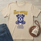 Beige "The Grey Muzzle Tour" t-shirt with a dog in a leather jacket, next to jeans and dog treats.