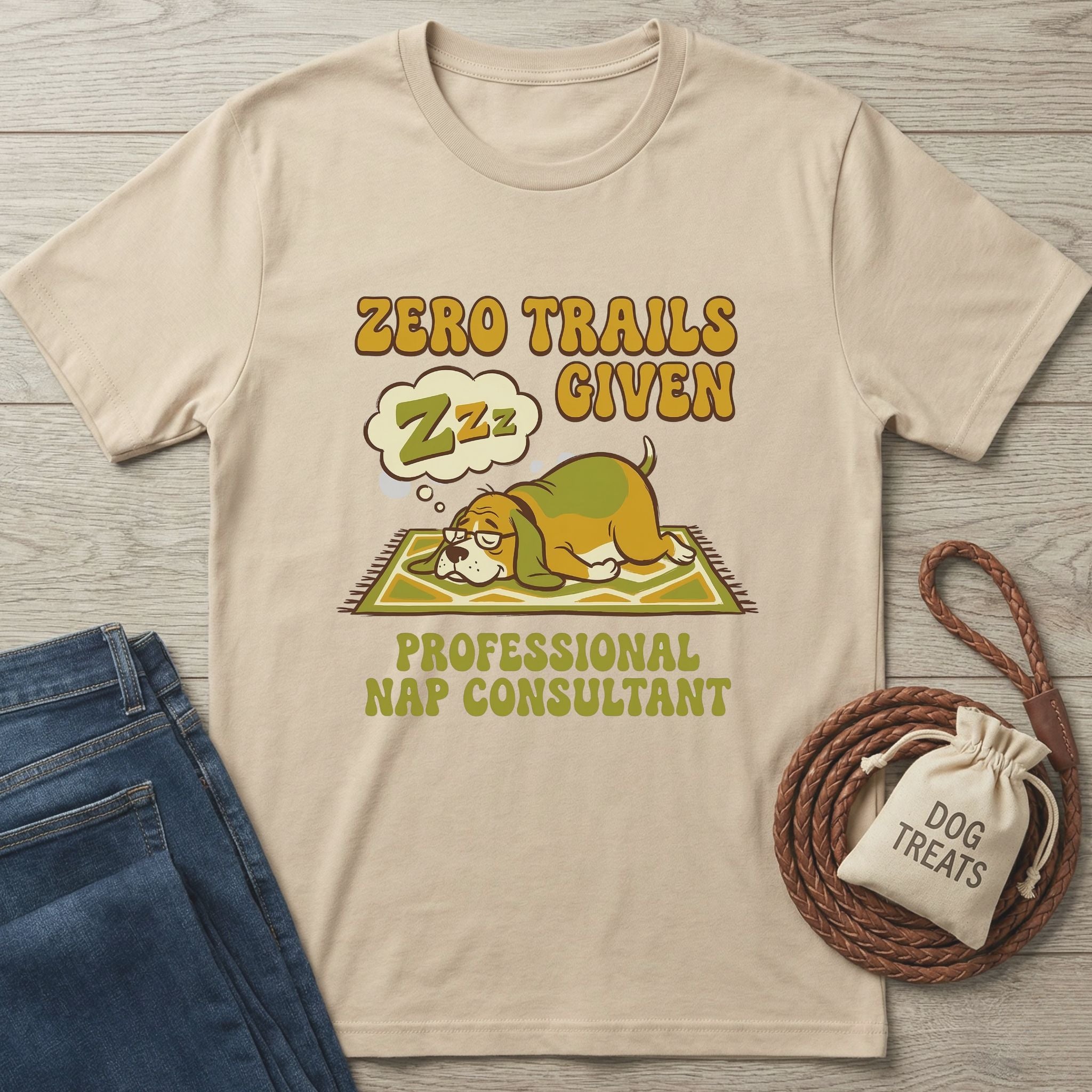 Sand Gildan Softstyle t-shirt with "Zero Trails Given" and a sleeping dog graphic.