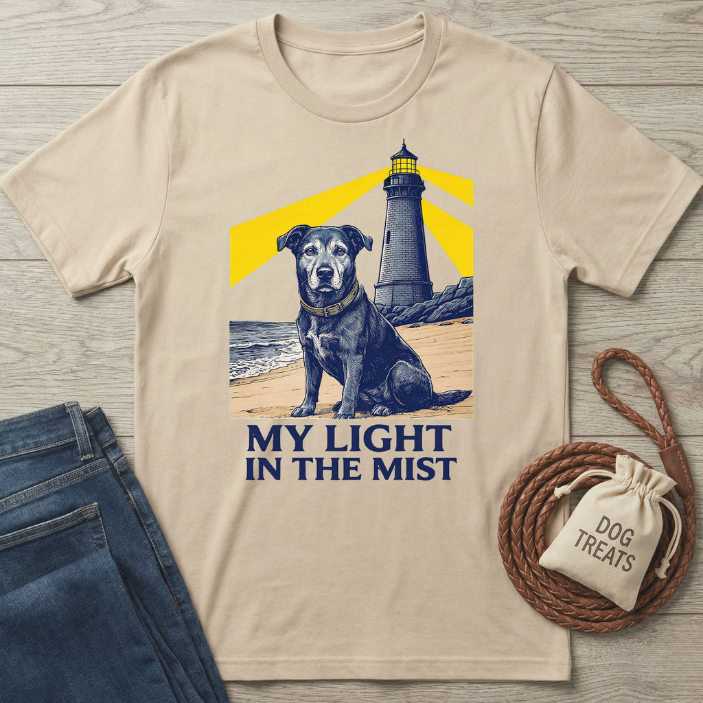 Light beige Gildan Softstyle® tee with a graphic of a rescue dog and lighthouse, "MY LIGHT IN THE MIST" text.