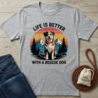 Light grey Gildan Softstyle t-shirt with "Life is Better With a Rescue Dog" text and a graphic of a happy dog, mountains, and trees.