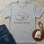 Light grey Gildan Softstyle® t-shirt with a sleeping dog outline, red heart, and "rescuing the old souls" text.