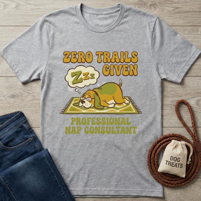 Gray "Zero Trails Given" t-shirt with a sleeping beagle graphic, next to jeans, a leash, and dog treats.