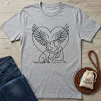 Gray t-shirt with a black line-art design of a person embracing a dog within angel wings and a heart.