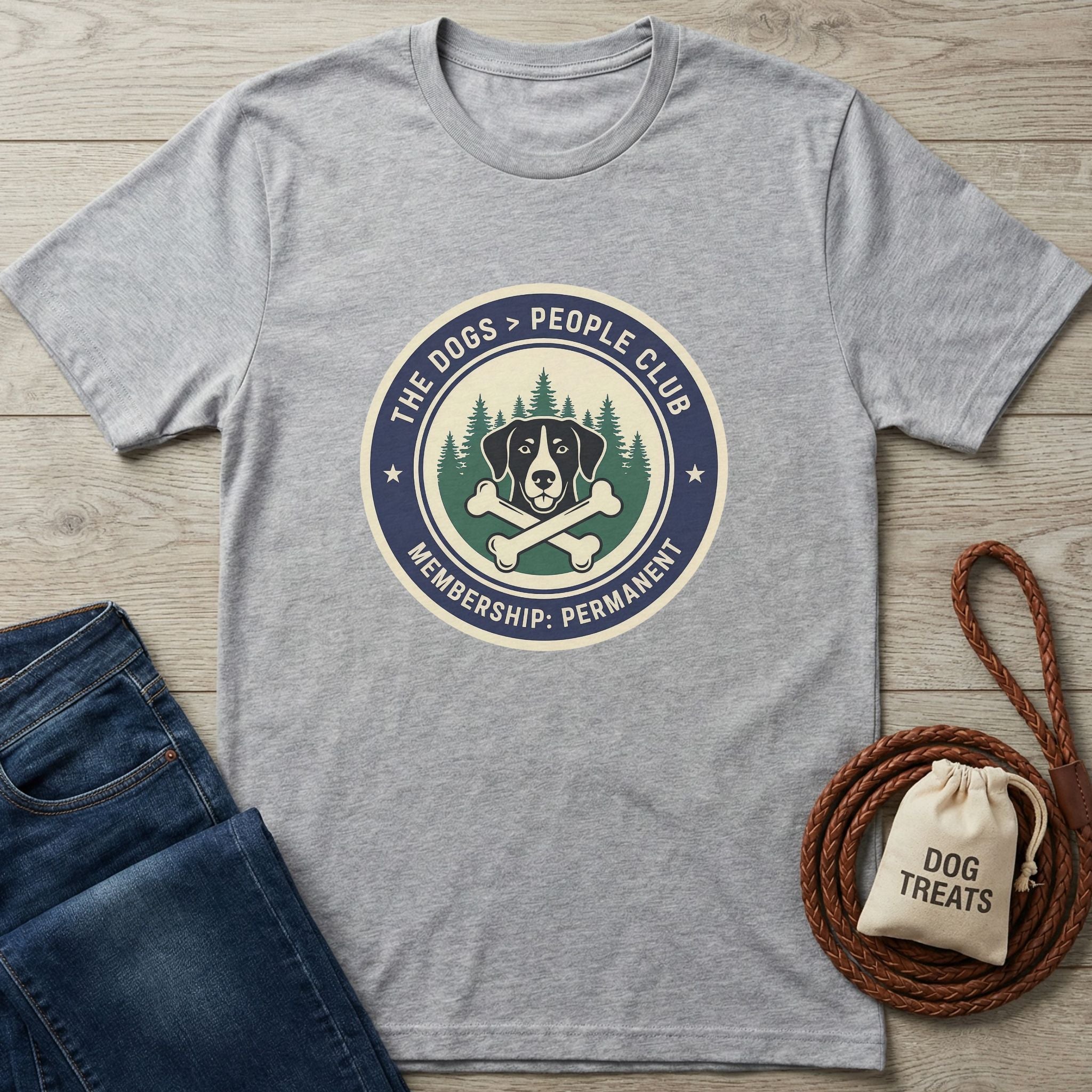 Light grey Gildan Softstyle t-shirt with "The Dogs > People Club" graphic, jeans, and dog accessories.