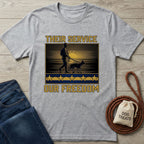 Light grey Gildan Softstyle t-shirt with "Their Service Our Freedom" graphic featuring a soldier and dog.