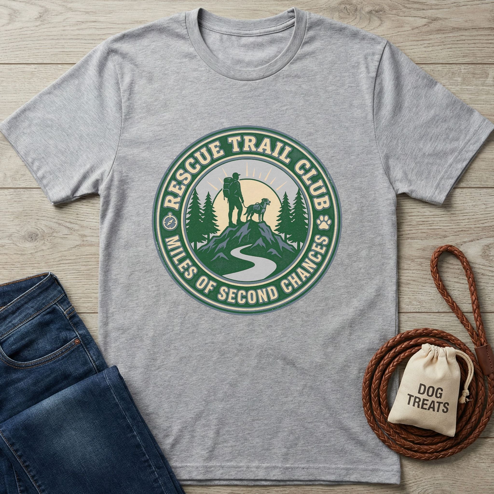Light grey Gildan Softstyle® T-shirt with a "Rescue Trail Club" graphic featuring a hiker, dog, and mountains.