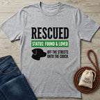 Light grey Gildan Softstyle t-shirt with "RESCUED STATUS: FOUND & LOVED" text and dog silhouette.