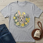 Light grey Gildan Softstyle® t-shirt with a graphic of a dog wearing bunny ears, surrounded by spring flowers and text "The Real Easter Bunny.