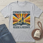 Light grey Gildan Softstyle t-shirt with "Stronger Together Rescue & Recover" graphic featuring a person and dog on a mountain.