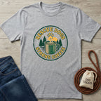 Gray Gildan Softstyle t-shirt with "Rescue Dogs Strong Coffee" graphic, featuring a paw print, coffee mug, and trees.
