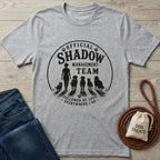 Heather gray crewneck t-shirt with "Official Shadow Management Team" graphic featuring a person and five dogs.
