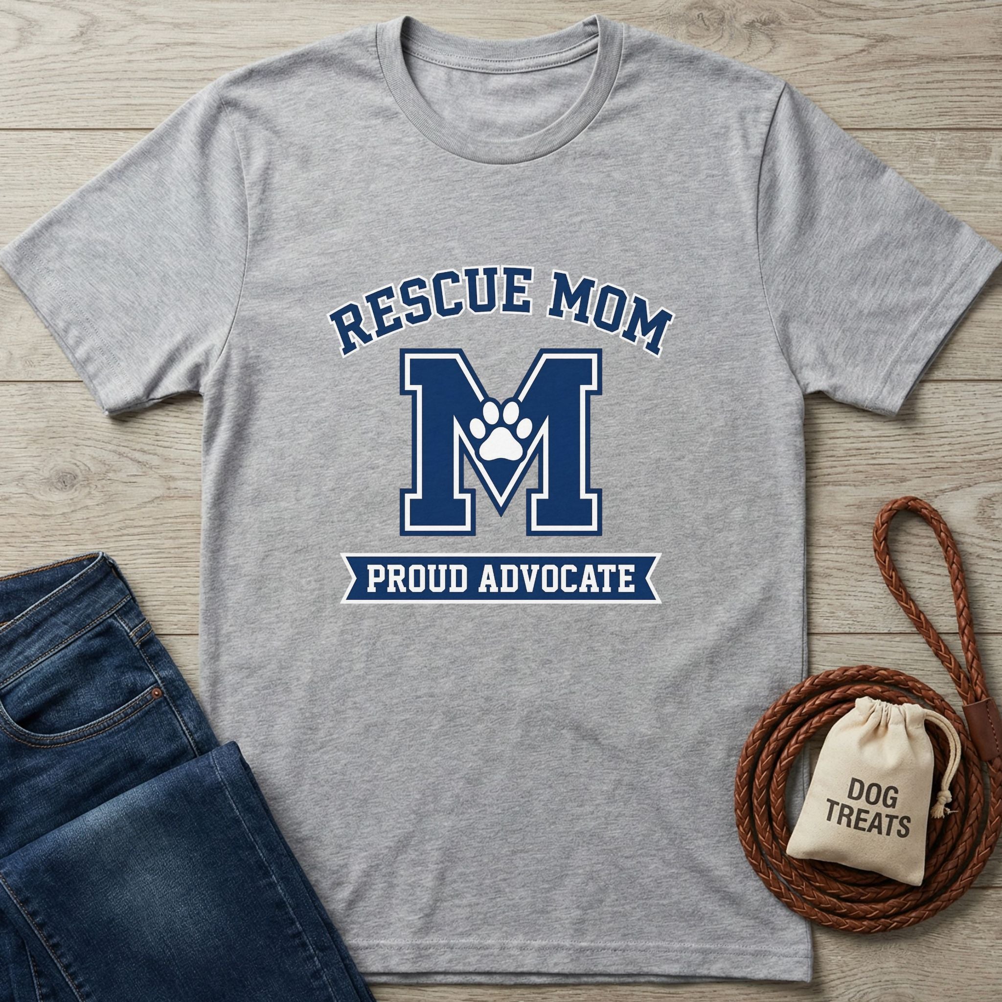 Light grey Gildan Softstyle t-shirt with "Rescue Mom M Proud Advocate" design and a paw print.
