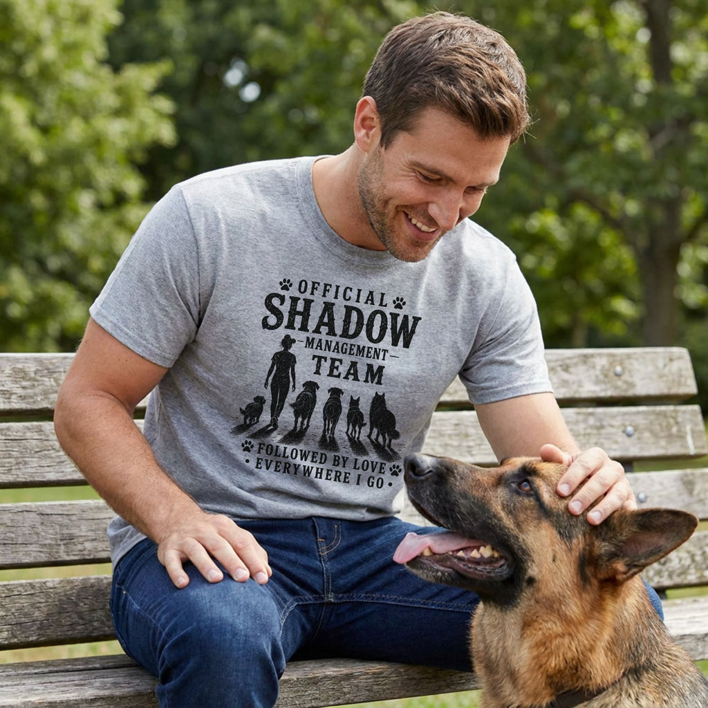 Gray cotton t-shirt with "Official Shadow Management Team" graphic, worn by a man petting a German Shepherd.