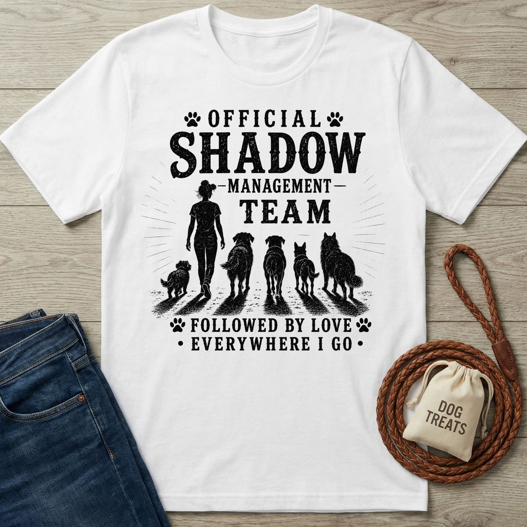 White cotton t-shirt with "Official Shadow Management Team" graphic featuring a person and five dogs.