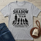Heather gray crewneck t-shirt with "Official Shadow Management Team" graphic featuring a person and five dogs.