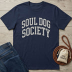 Navy blue "Soul Dog Society" t-shirt with white arched text, next to jeans and dog treats.