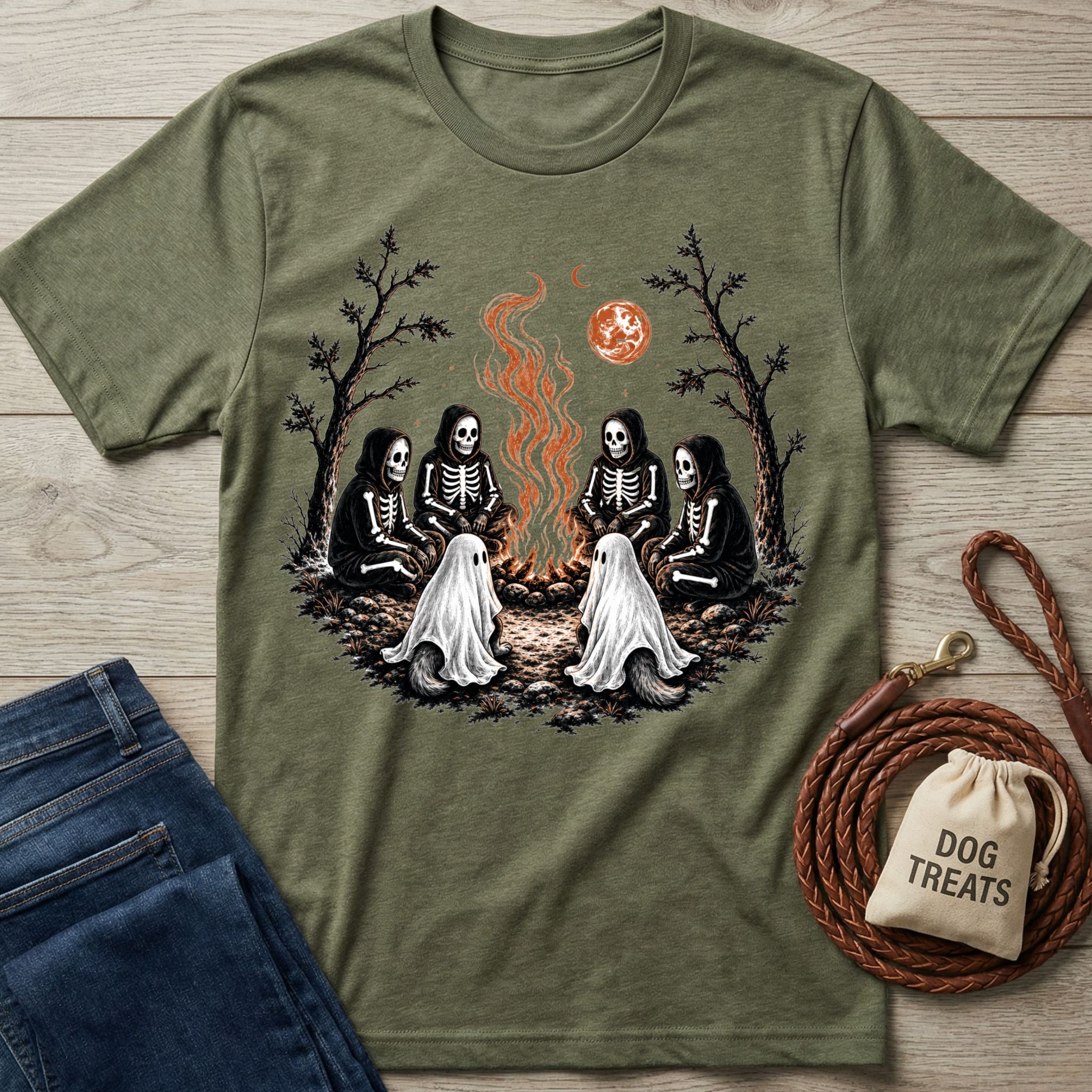 Olive green crewneck t-shirt featuring skeletons and ghost dogs sitting around a campfire under a blood moon.