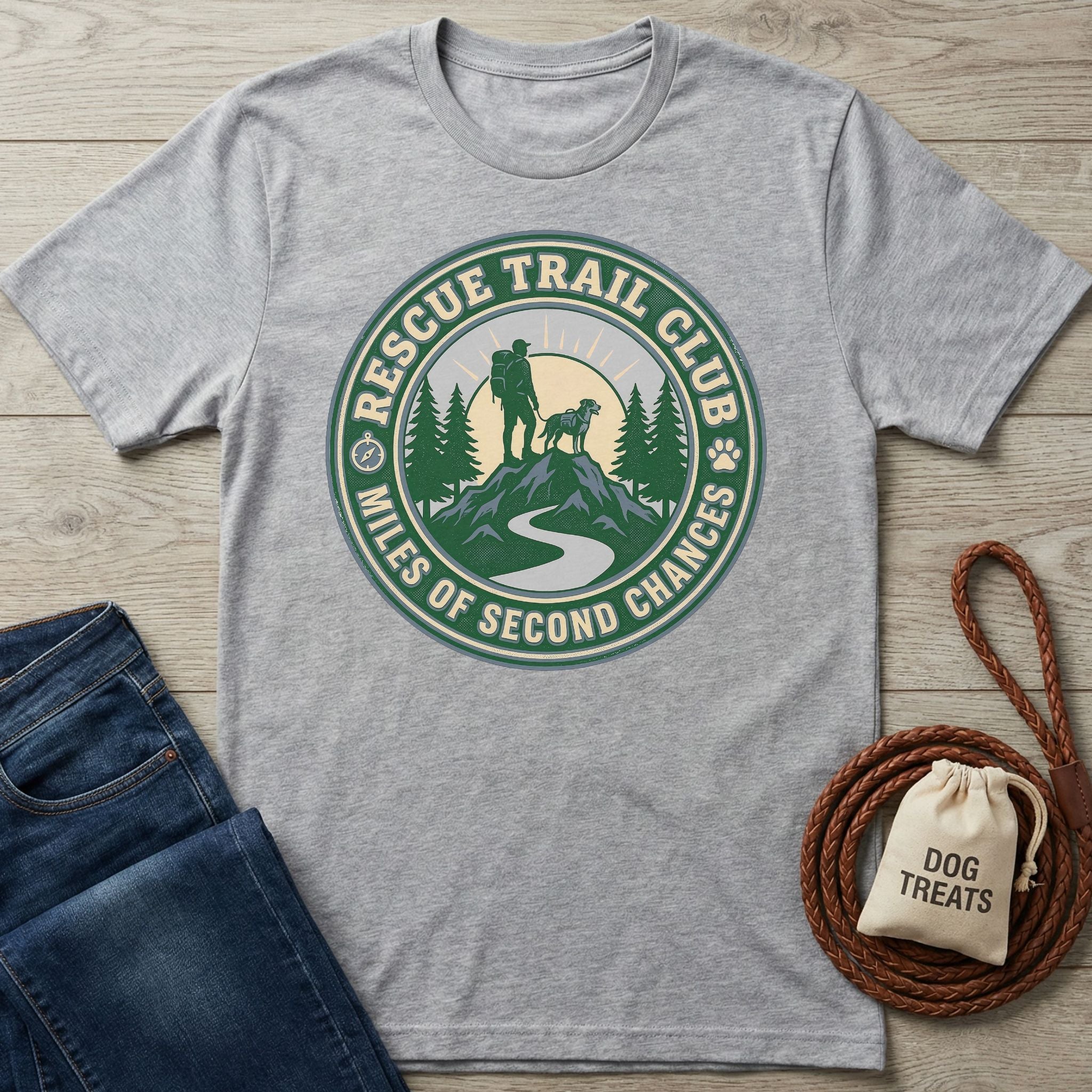 Light grey Gildan Softstyle® T-shirt with a "Rescue Trail Club" graphic featuring a hiker, dog, and mountains.