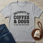 Light grey Gildan Softstyle t-shirt with "University of Coffee & Dogs" graphic, next to jeans and dog treats.