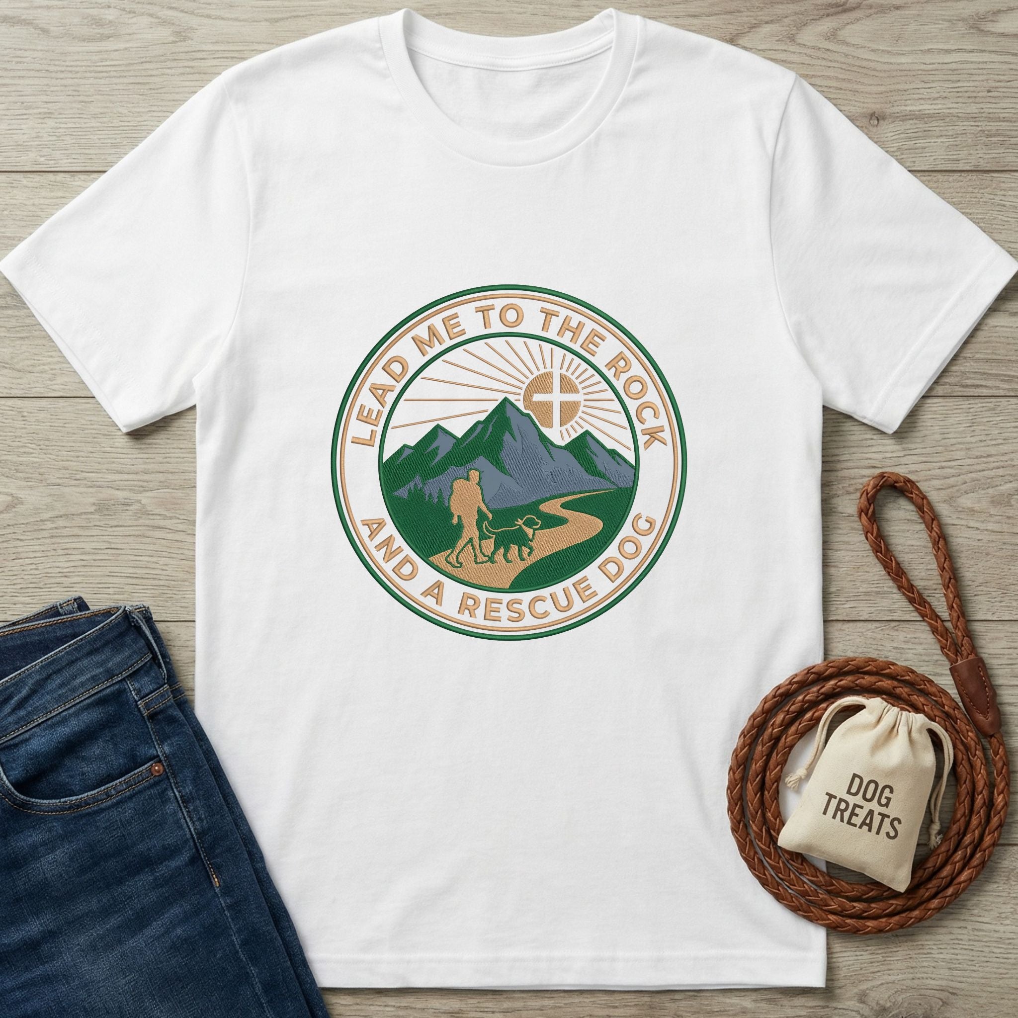 White Gildan Softstyle® 64000 t-shirt with "Lead Me To The Rock And A Rescue Dog" graphic, jeans, and dog treats.
