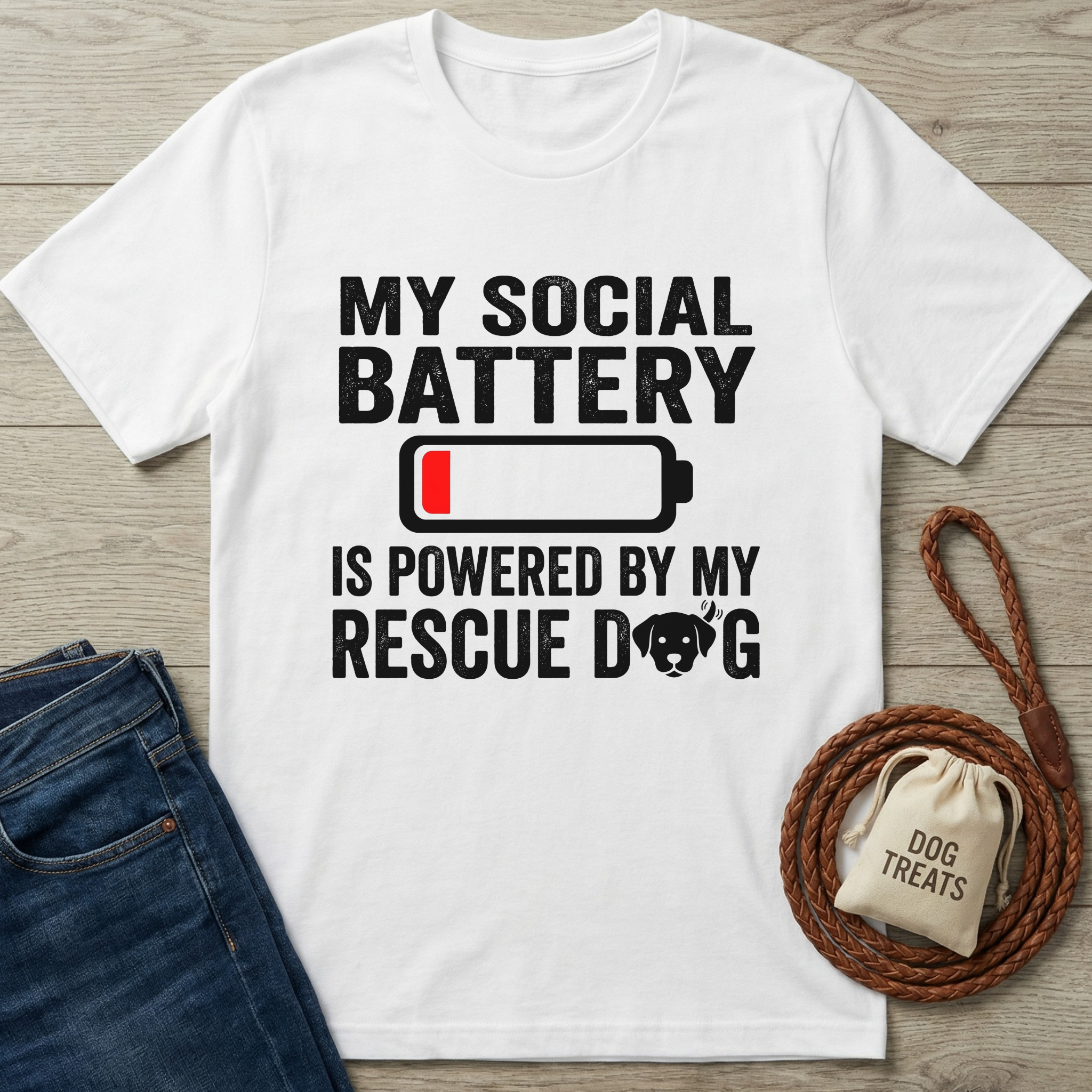 White cotton t-shirt with "My Social Battery Is Powered By My Rescue Dog" text and battery icon.