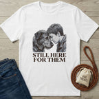White Gildan Softstyle t-shirt with a graphic of a person and dog, "Still Here For Them" text.