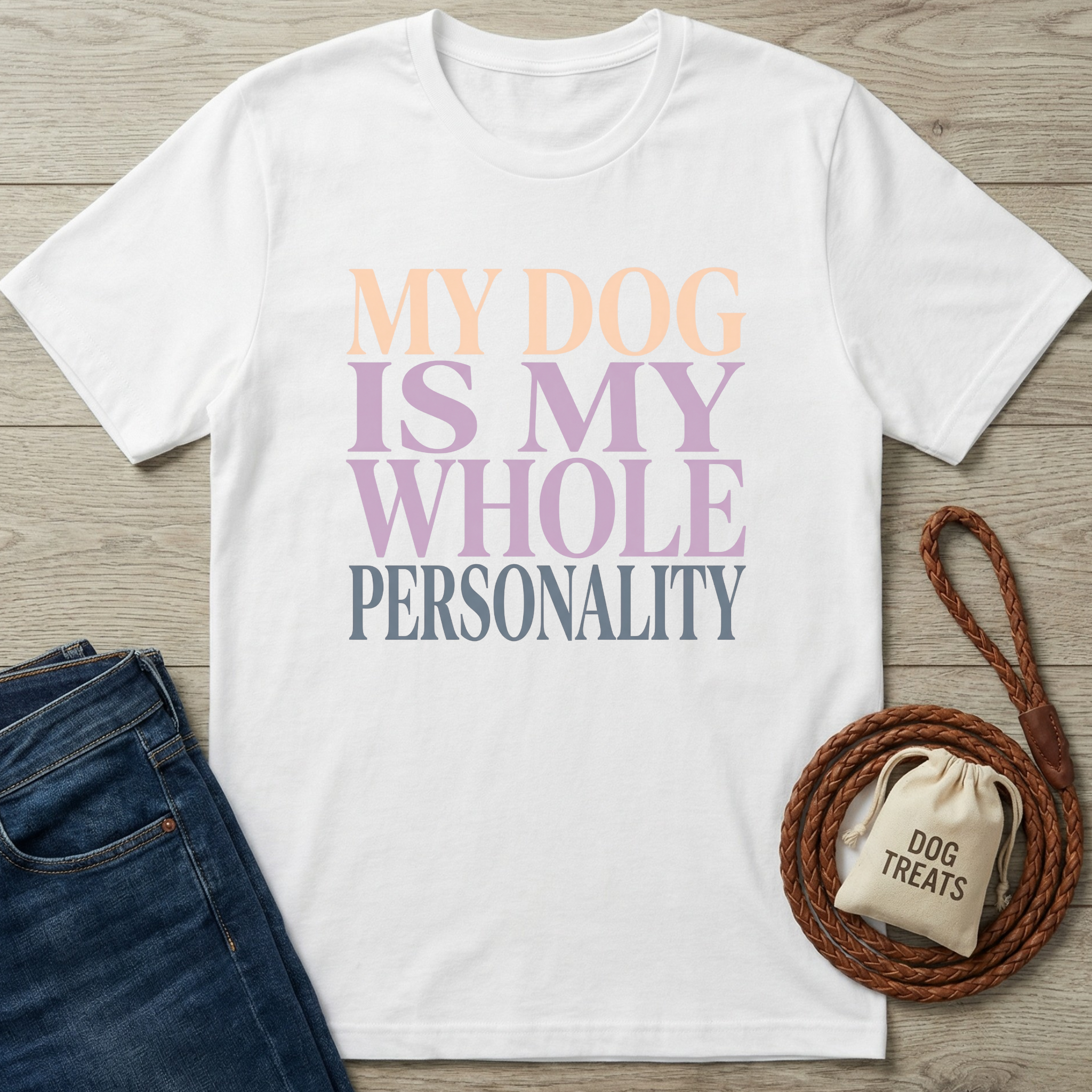 White cotton t-shirt with "My Dog Is My Whole Personality" text in pastel orange, purple, and grey.